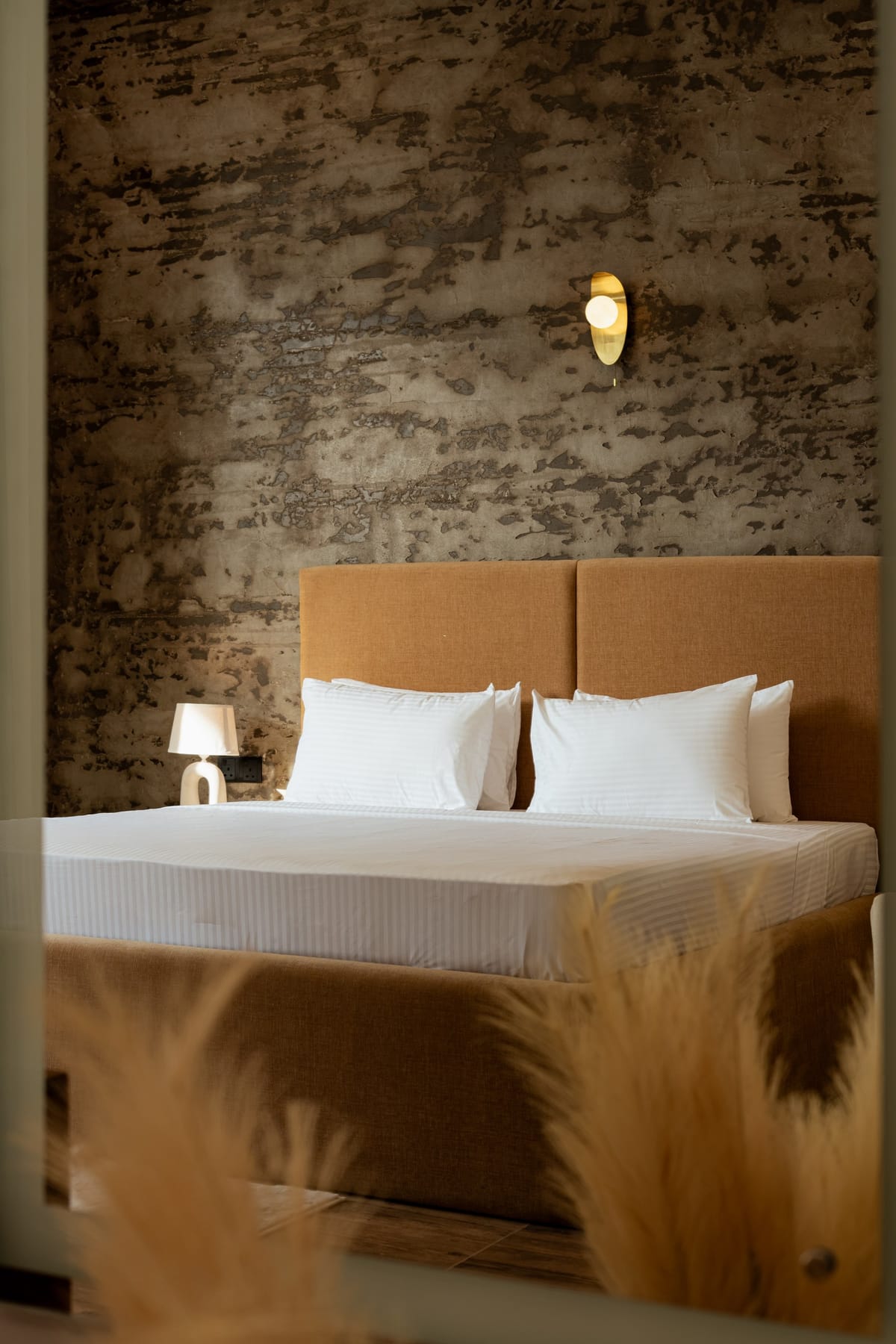 Pool View Room 2, headboard and stone wall