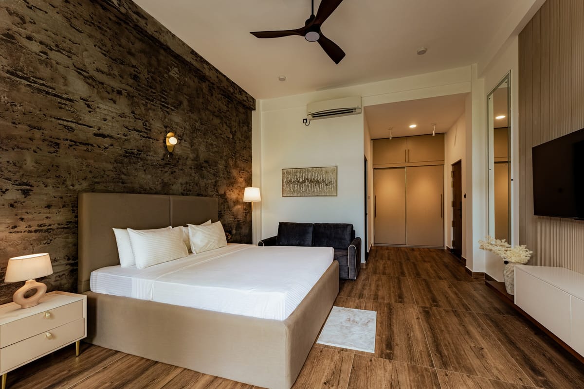 Pool View Room 1, stone wall and wardrobe