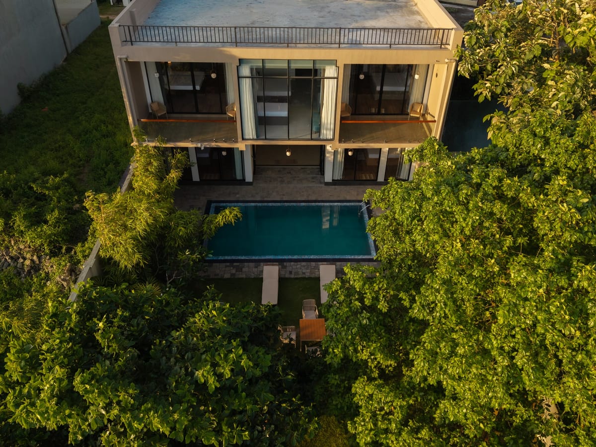 Rivara from above: the hotel, its pool and tropical garden